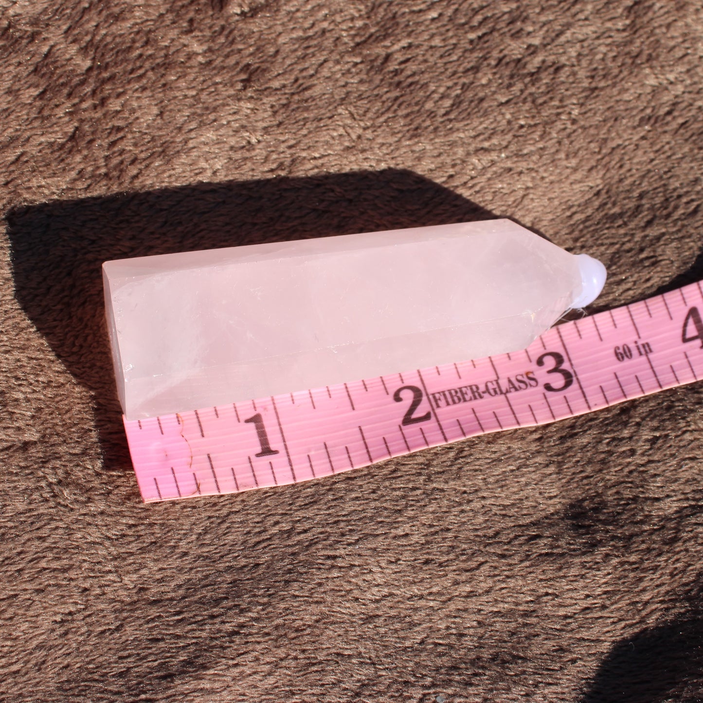 Rose Quartz tower with a smooth finish, ideal for decor or healing purposes
