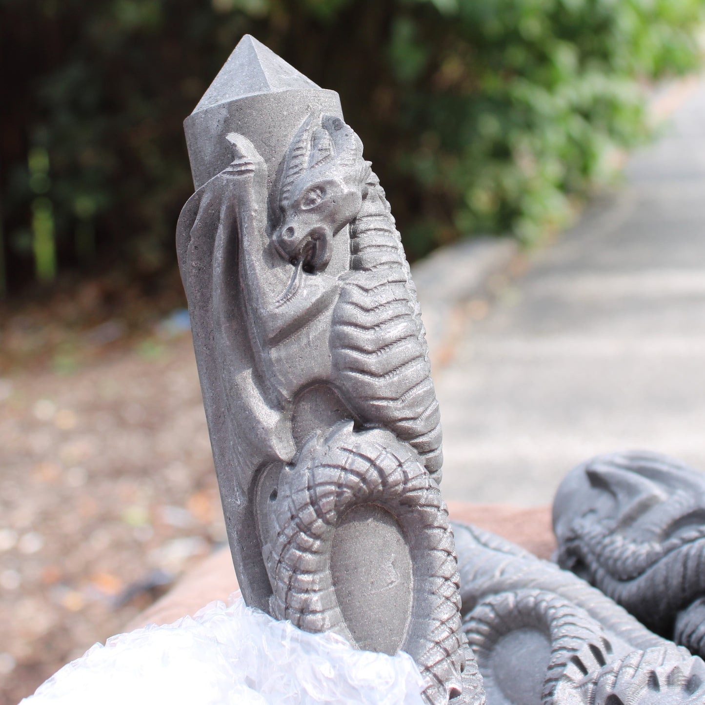 Shungite Dragon Tower crystal carved with detailed dragon design from Different Branches LLC