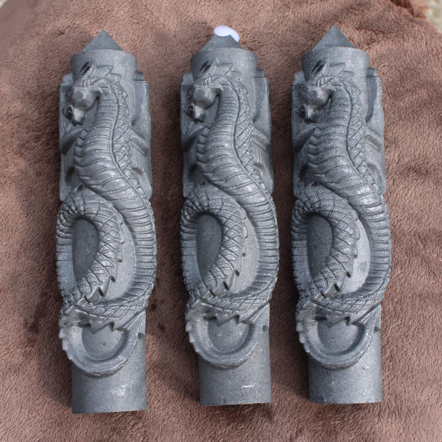Different Branches LLC Shungite Dragon Tower crystal with detailed carved dragon design in black stone
