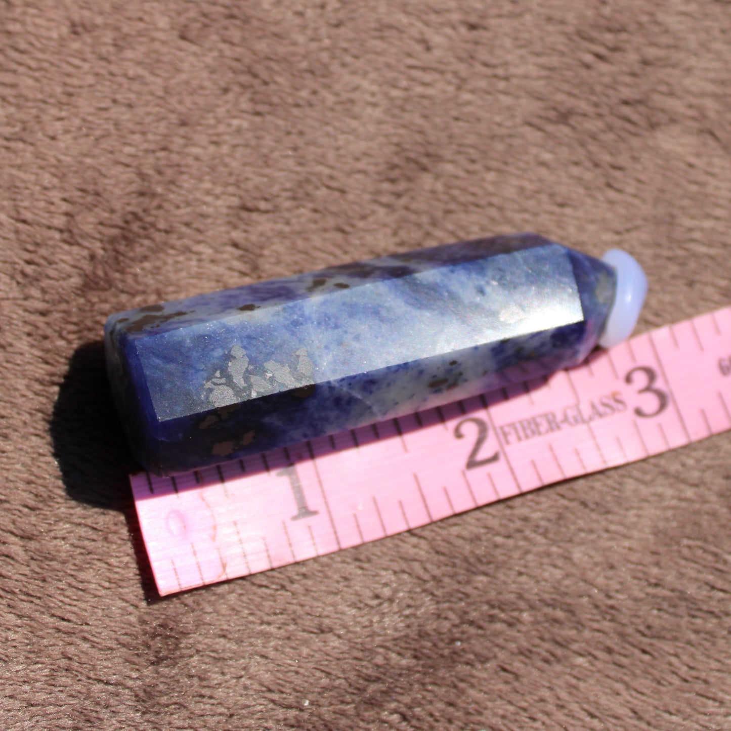 Sodalite tower crystal with natural blue hues and unique patterns for healing and decor