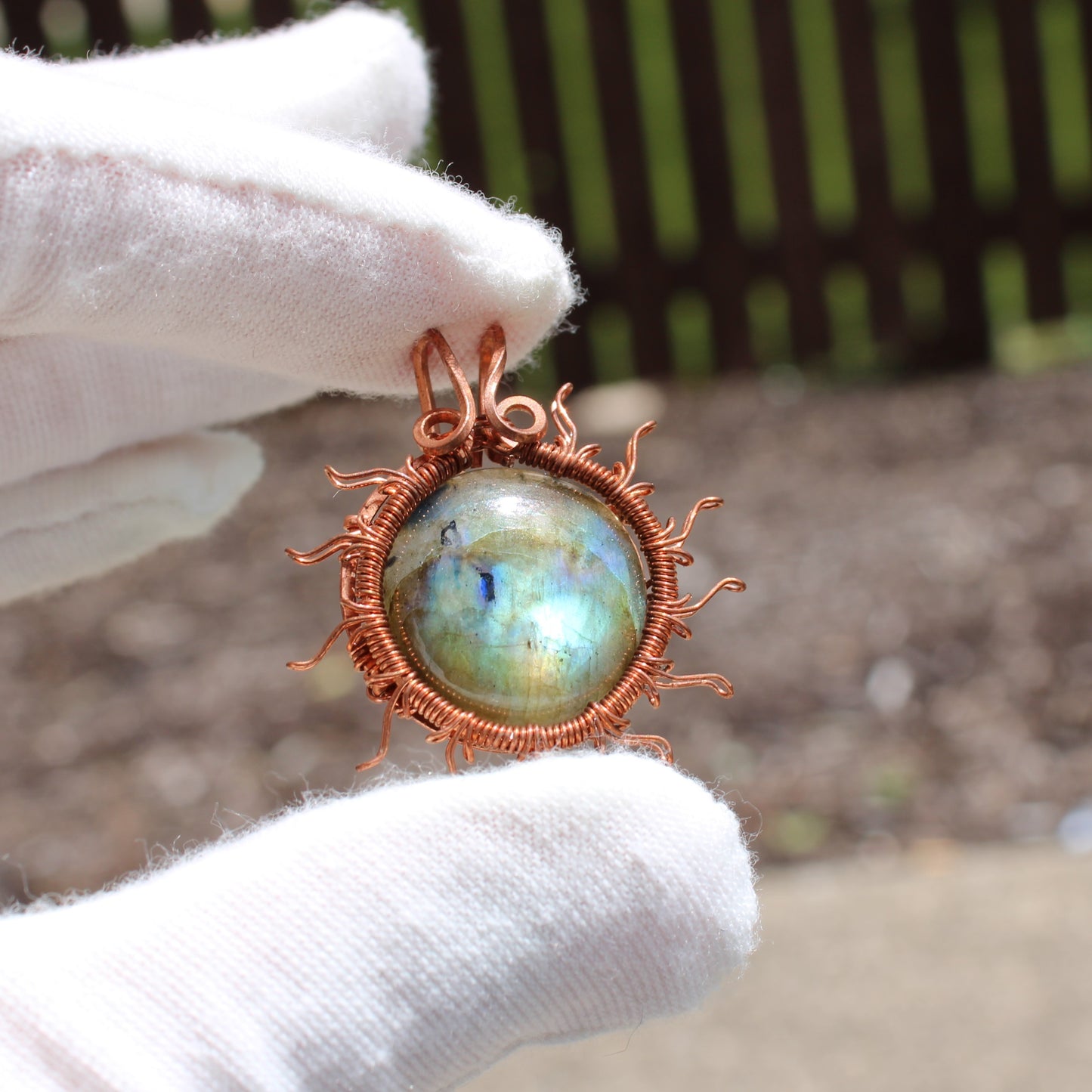 Sun and moon copper collection pendant featuring a labradorite stone in a sunburst design