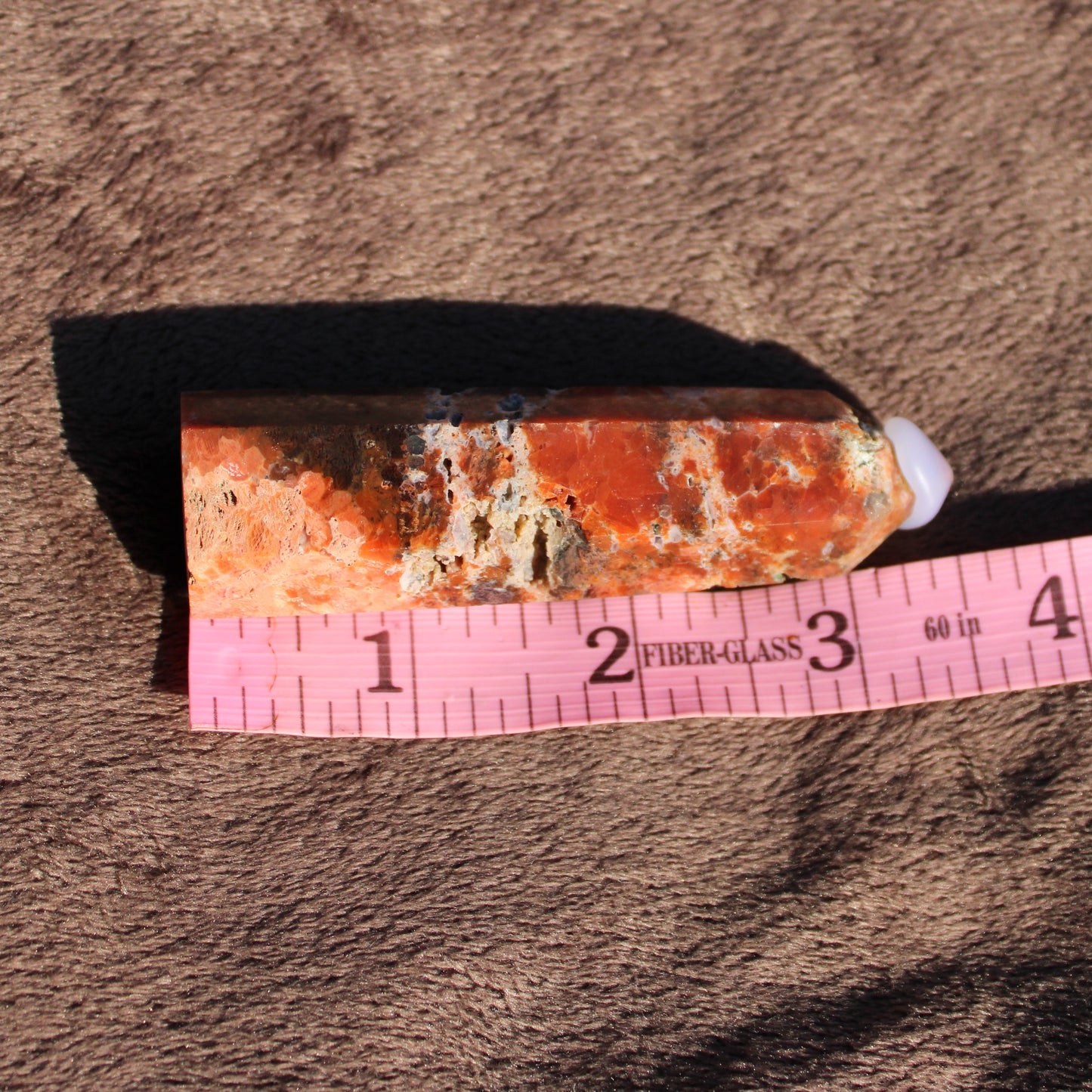 Beautiful Sunstone tower crystal with natural orange hues and unique texture for healing and decor
