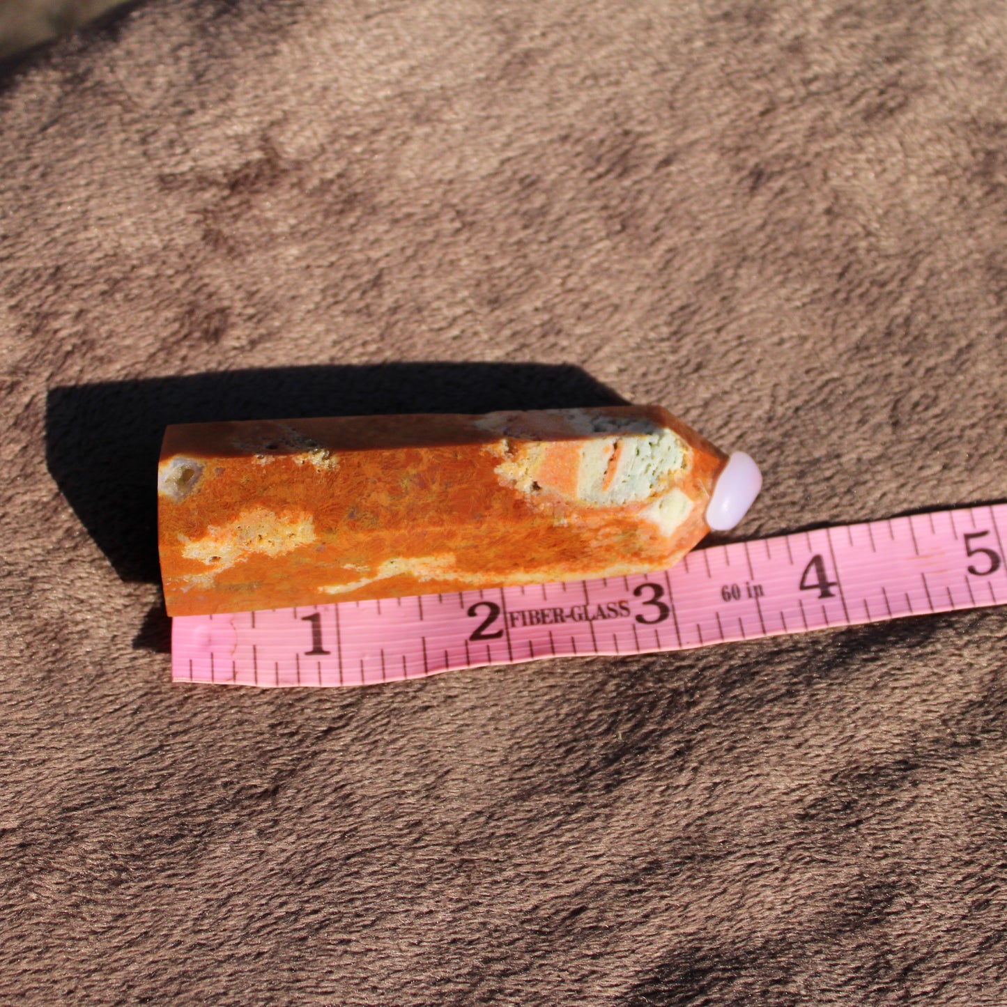 Sunstone tower with warm orange hues, perfect for crystal healing and decoration