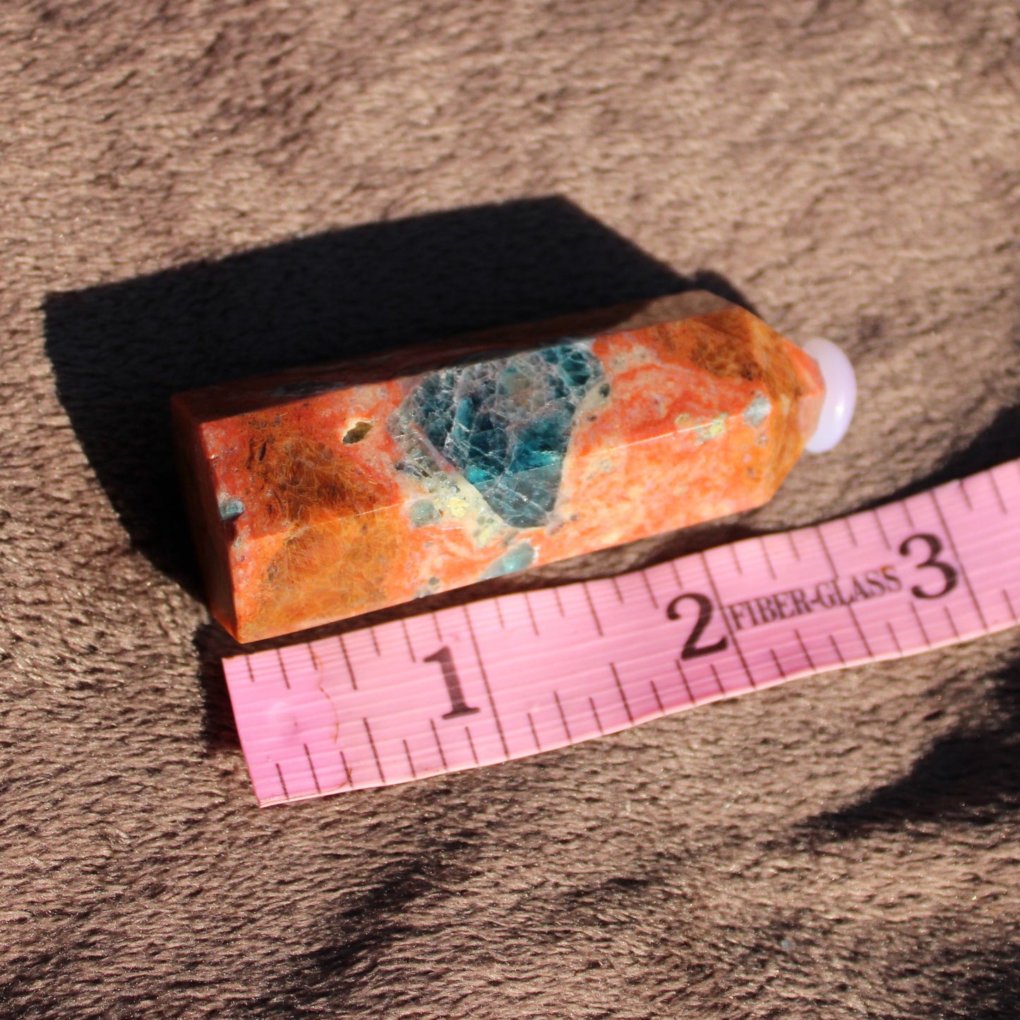 Sunstone tower with vibrant orange and blue hues, perfect for crystal enthusiasts and collectors