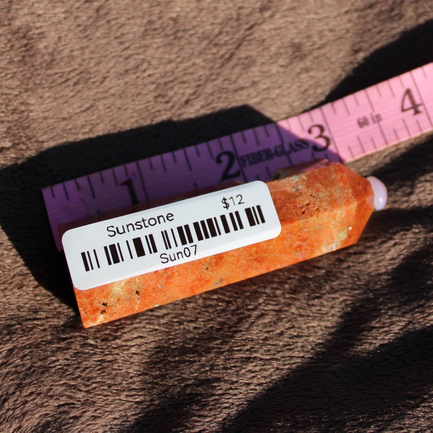 Sunstone tower by Different Branches LLC with vibrant orange hues, measuring 3 inches in length