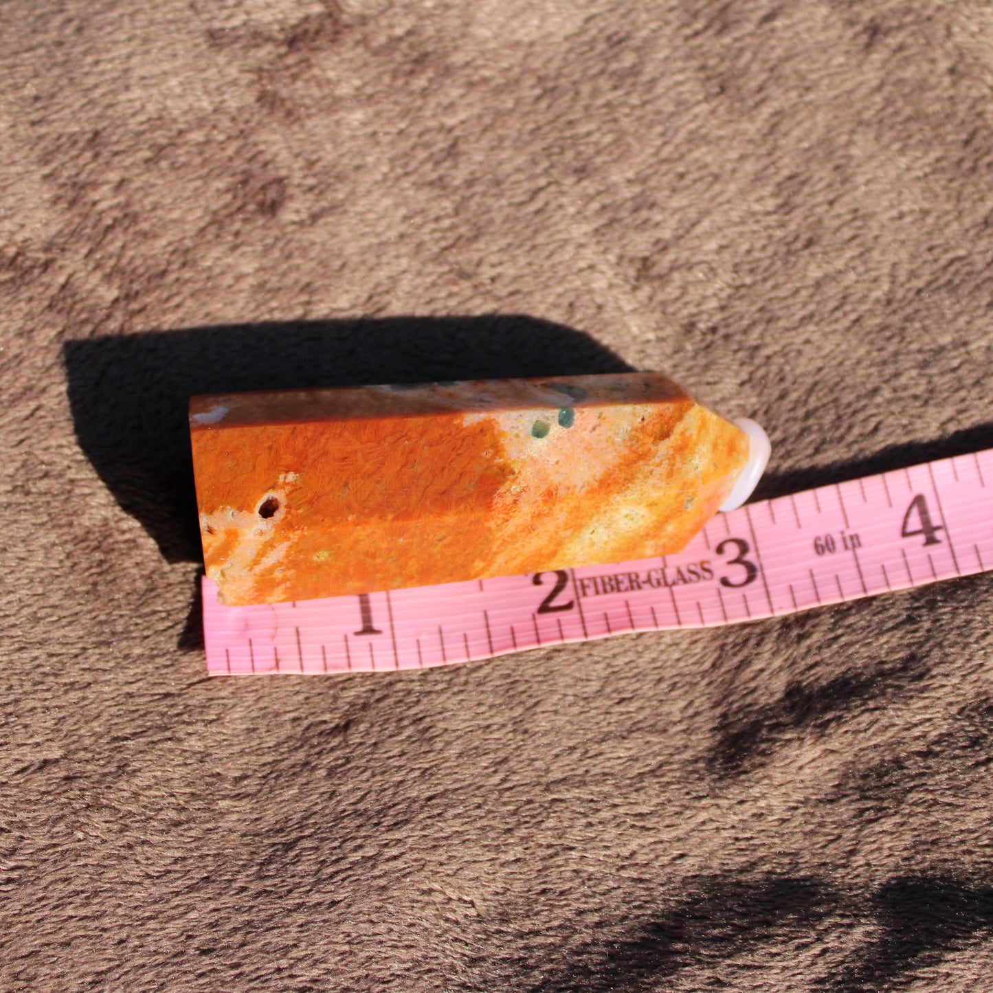 Sunstone tower from Different Branches LLC with natural orange hues and unique texture