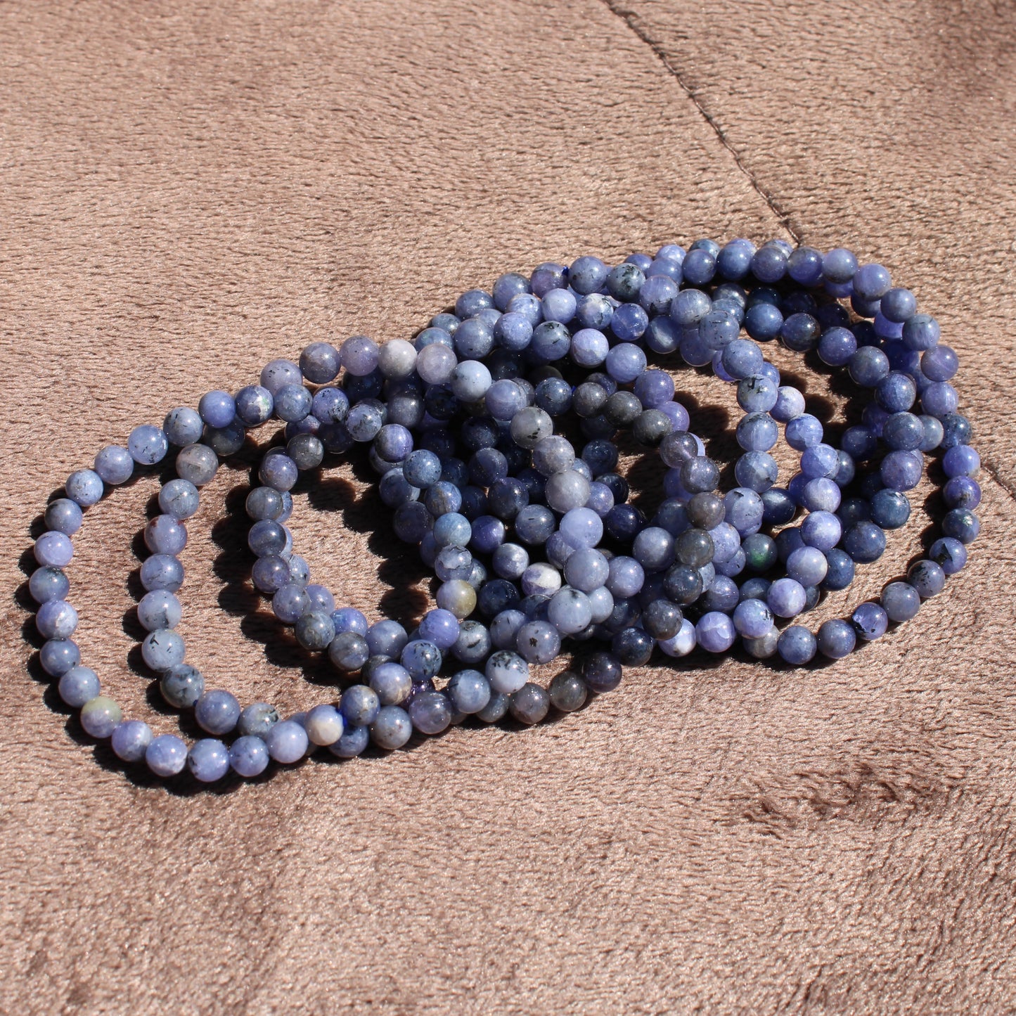 Elegant Tanzanite Bracelet featuring round beads in various shades of blue, perfect for everyday wear
