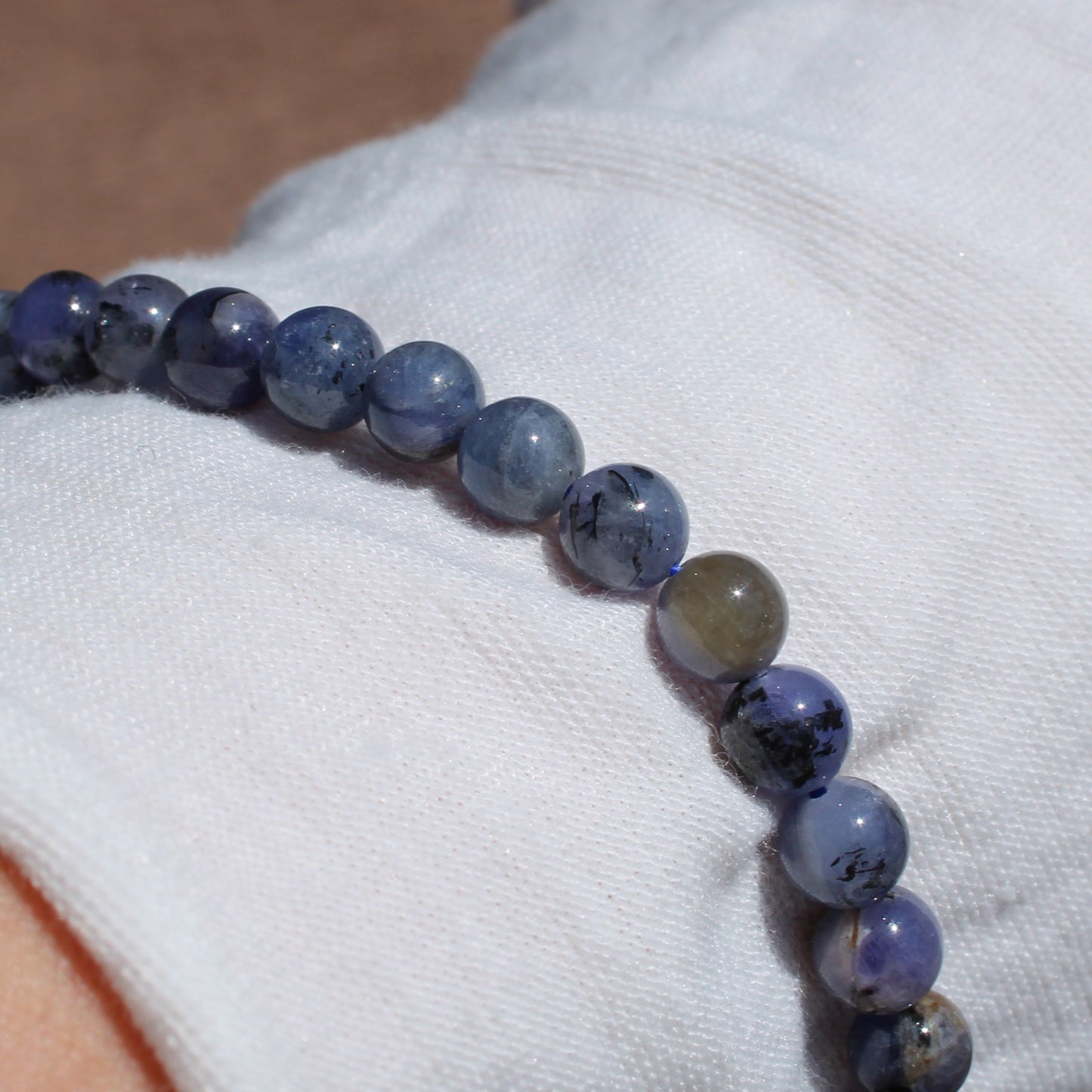 Elegant Tanzanite Bracelet made with smooth beads, showcasing rich blue hues and natural variations