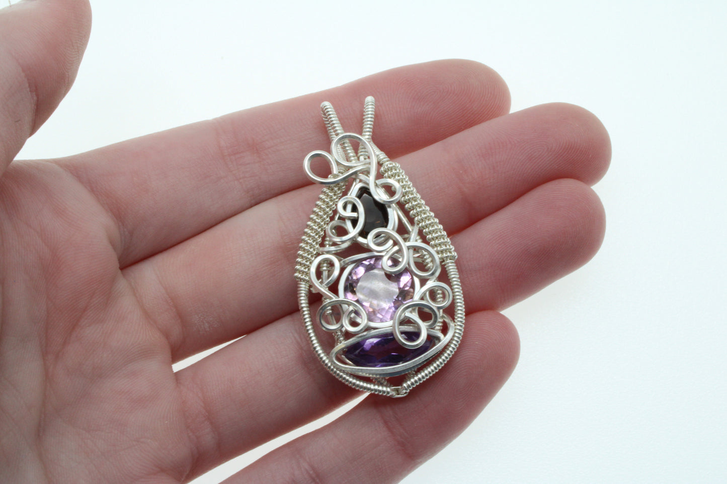 Handcrafted Tri Quartz sterling pendant with intricate wire design and gemstones for elegant jewelry lovers