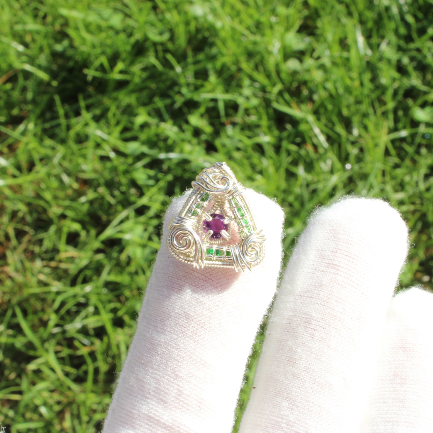 Unique sterling silver ring featuring tsavorite and amethyst gemstones in a stylish design