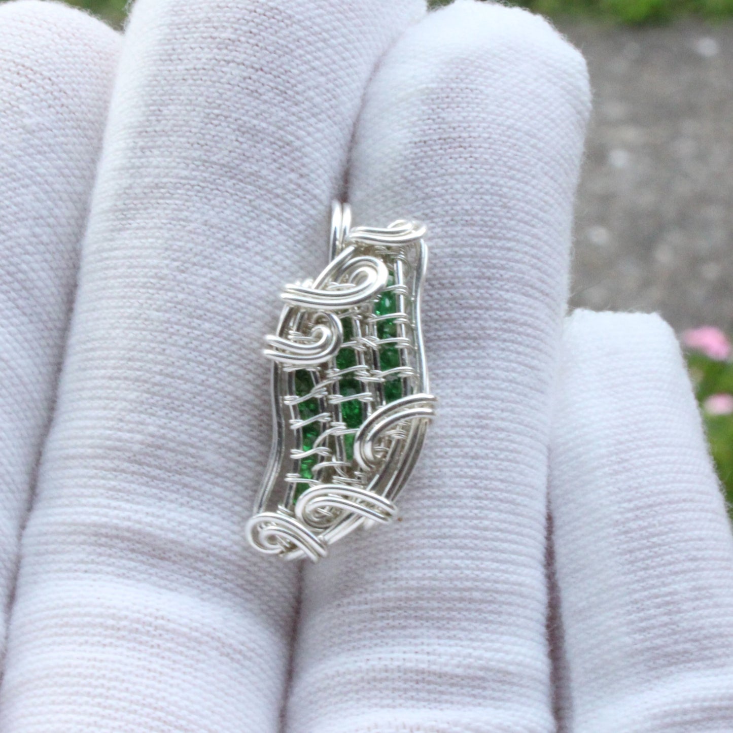 Handcrafted Tsavorite Sterling Silver Pendant with intricate wire design and green gemstones