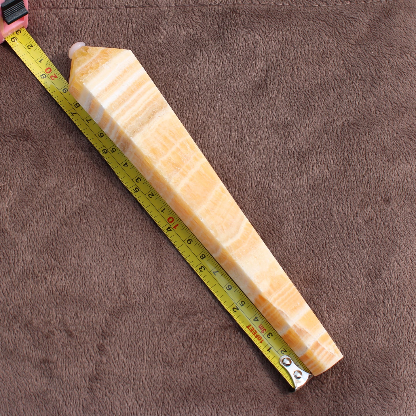 Honey Calcite Wand measuring approximately 9 inches with smooth polished surface from Different Branches LLC