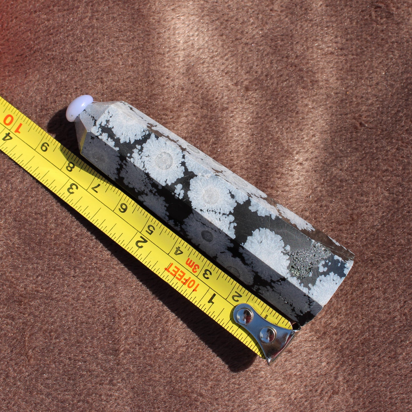 Snowflake Obsidian Tower crystal measuring approximately 4 inches with white snowflake patterns on black stone