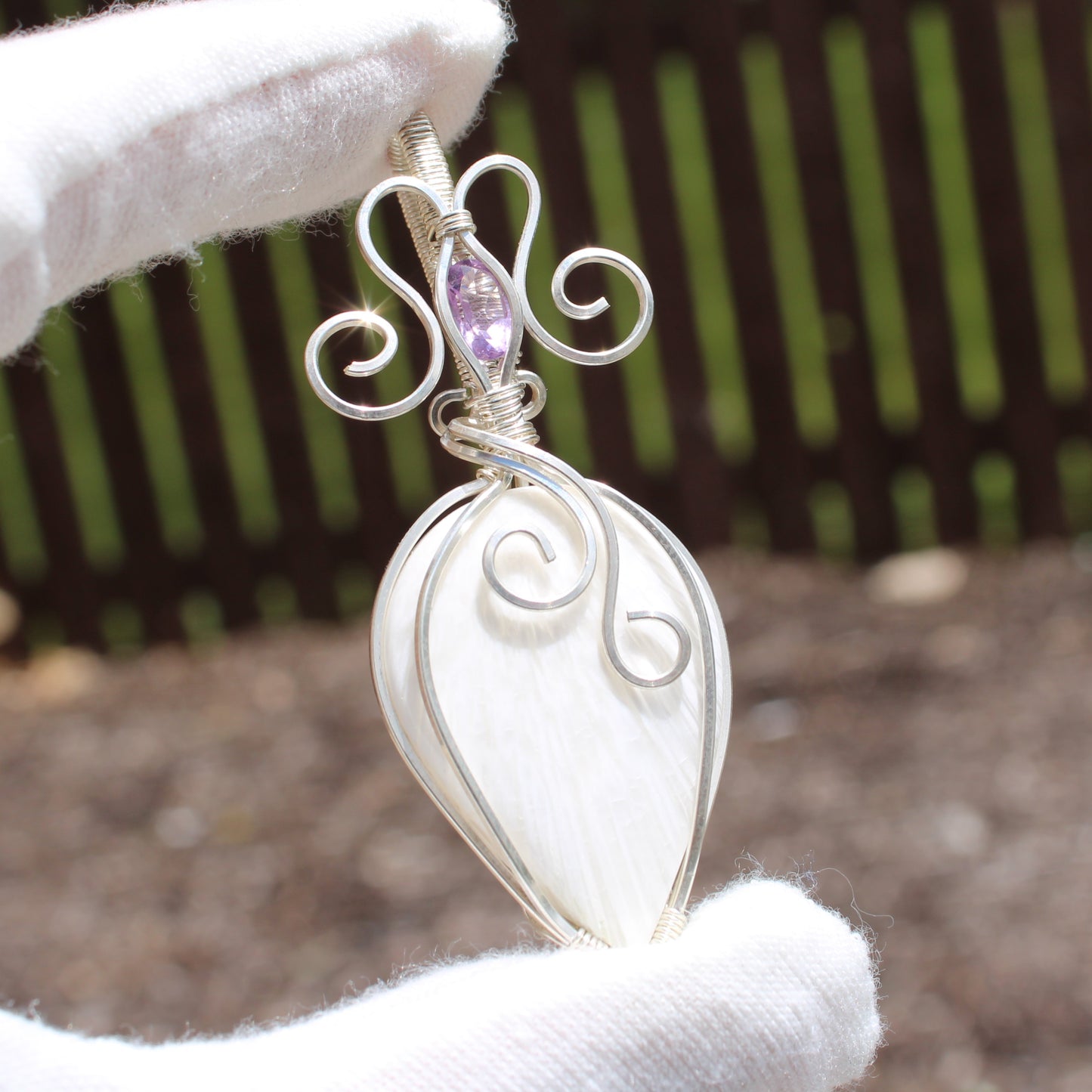 Handcrafted pendant featuring a unique design in sterling silver with amethyst accent for elegant jewelry lovers