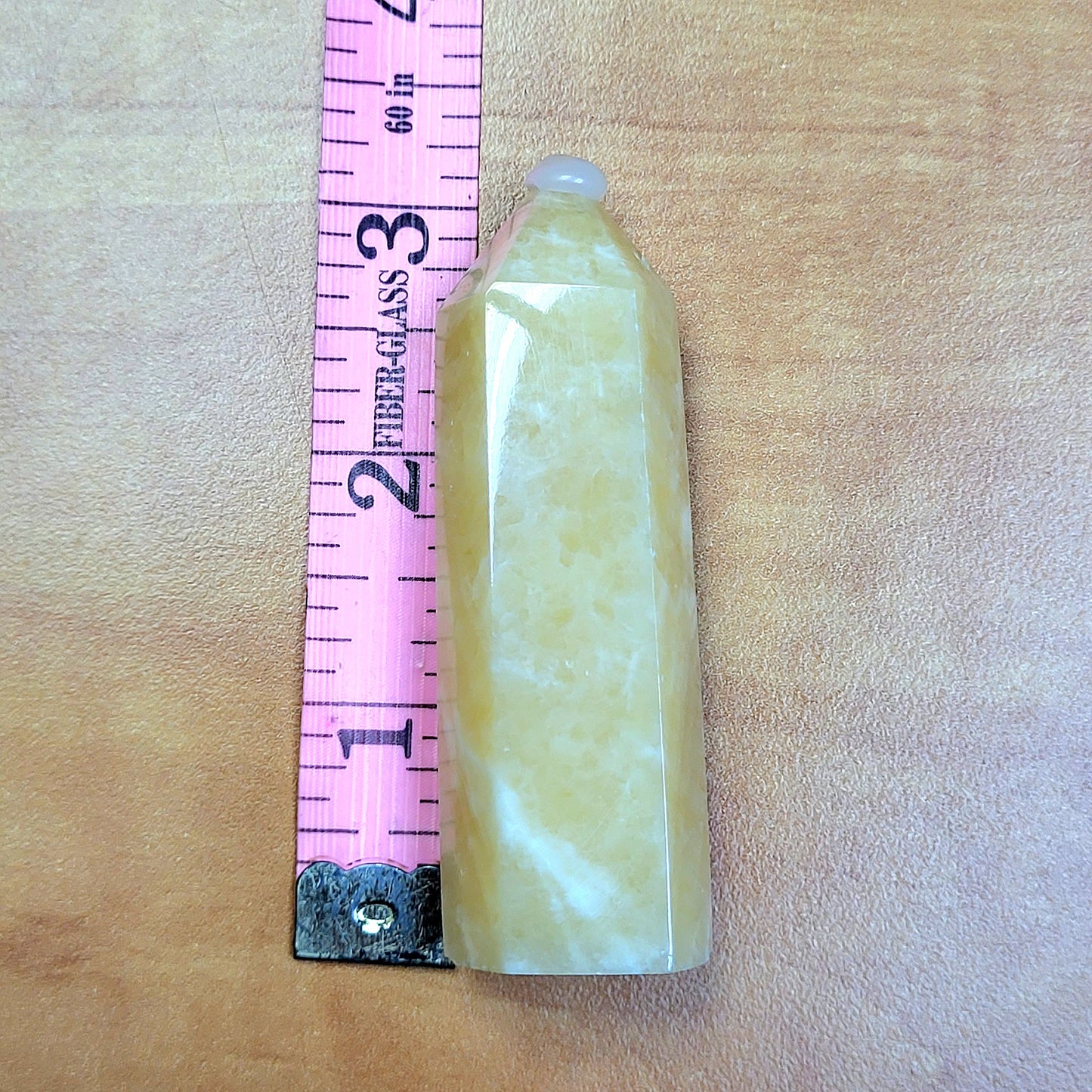 My Store Yellow Calcite Towers Crystal Displayed Next to a Ruler for Size Reference