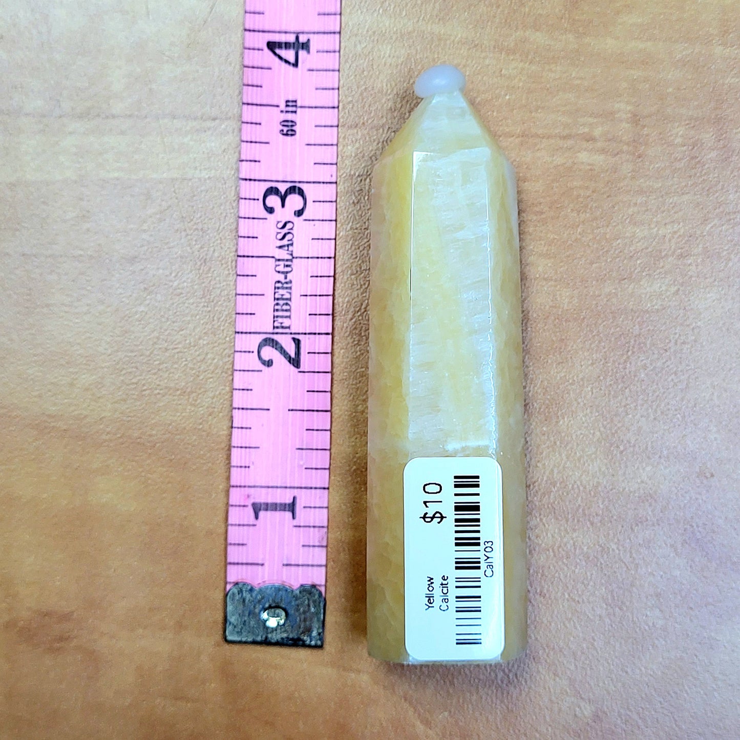 Yellow Calcite Towers in unique shapes with a price tag, ideal for crystal collectors
