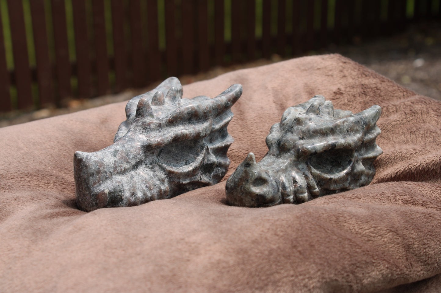 Yooperlight dragon head sculpture carved from crystal, featuring intricate details and a mystical design