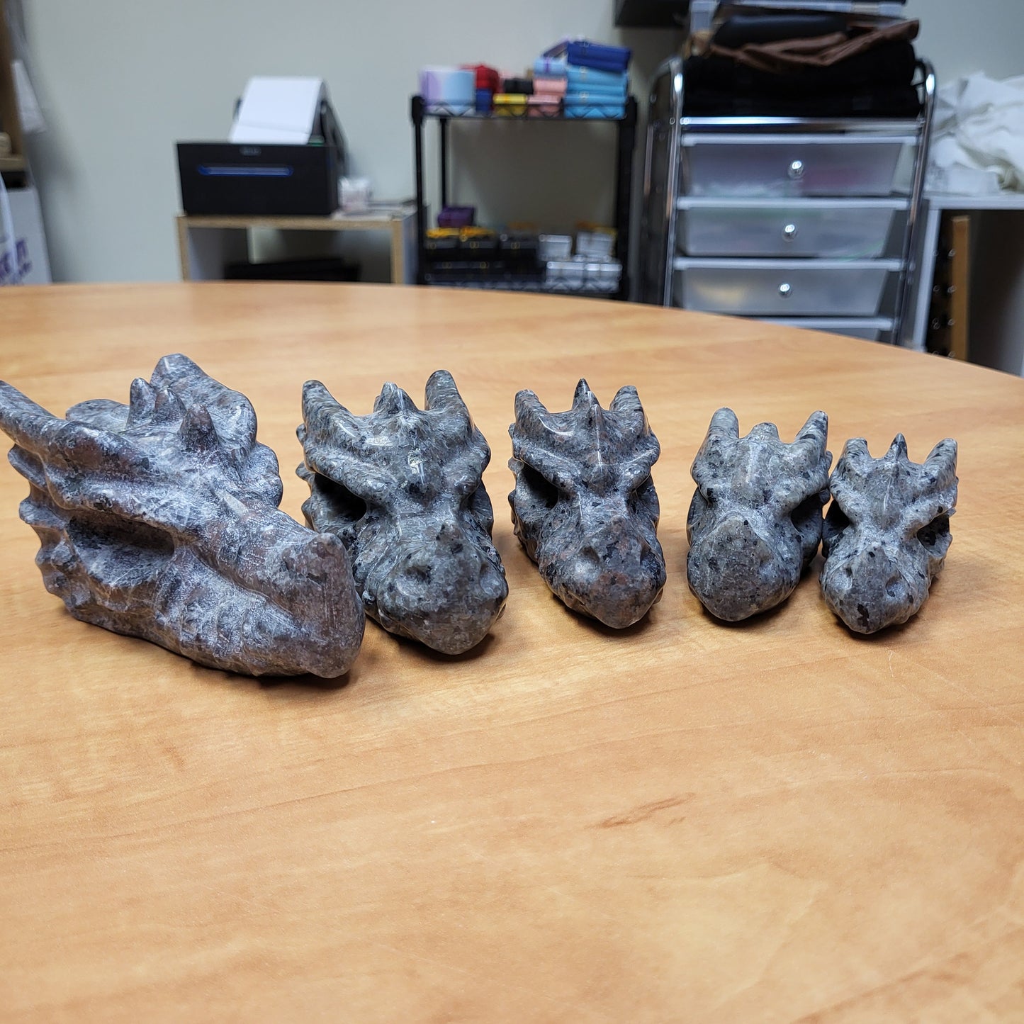 Yooperlight dragon head sculpture set featuring five intricately detailed dragon heads in various sizes