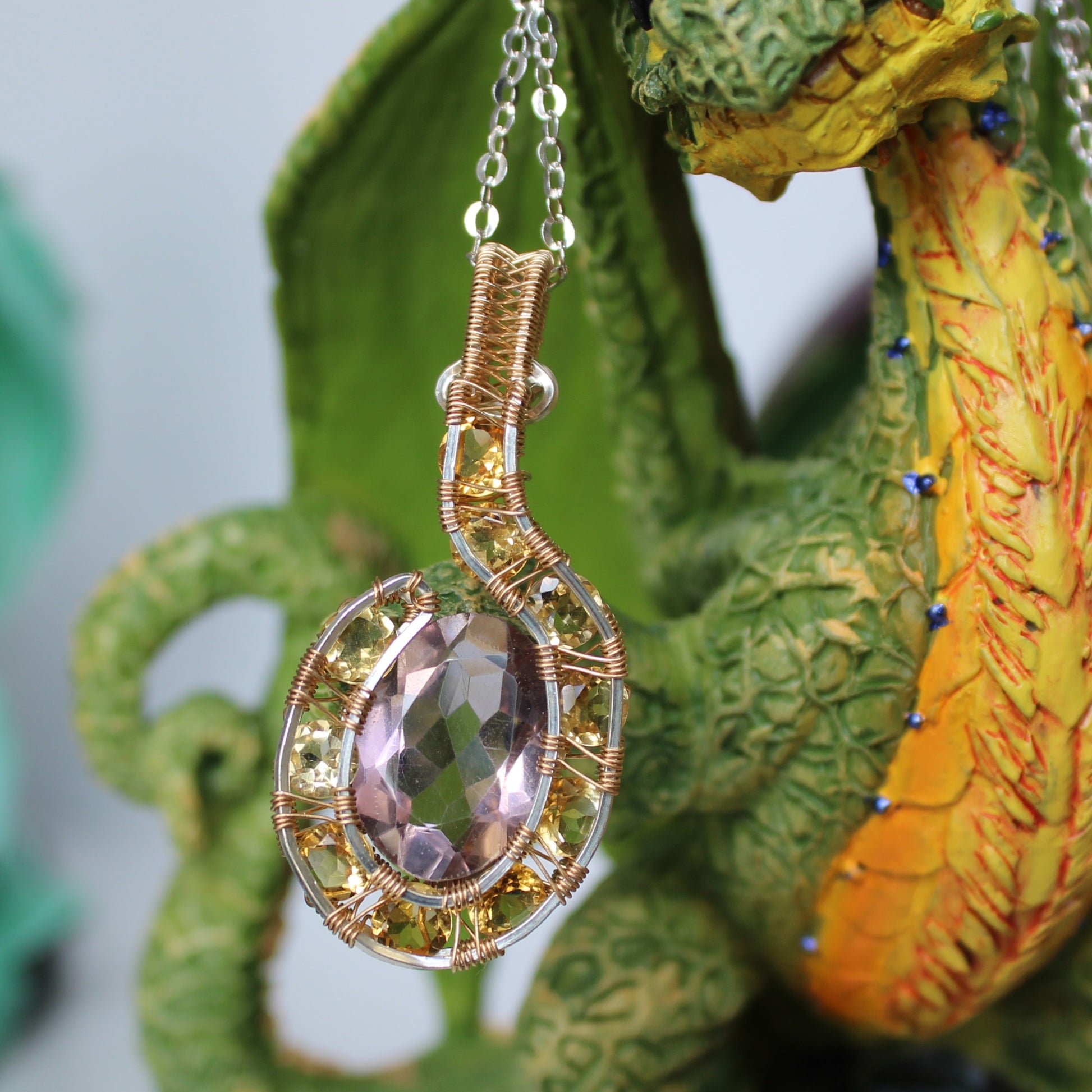 Handcrafted amethyst citrine pendant with intricate wire wrap design, perfect for unique jewelry lovers
