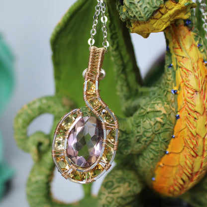 Handcrafted amethyst citrine pendant with intricate wire wrap design, perfect for unique jewelry lovers