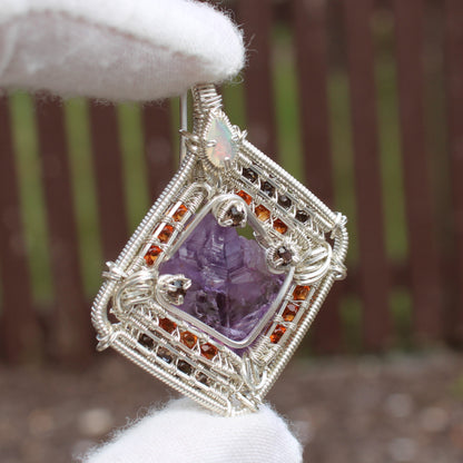 Handcrafted jewelry pendant featuring amethyst garnet opal silver wire wrap design by Different Branches LLC