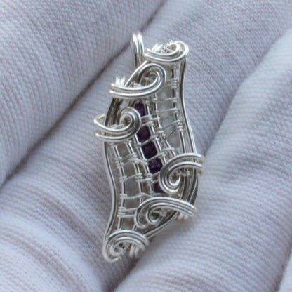 Sterling silver pendant featuring Amethyst and Moonstone in a unique wire design