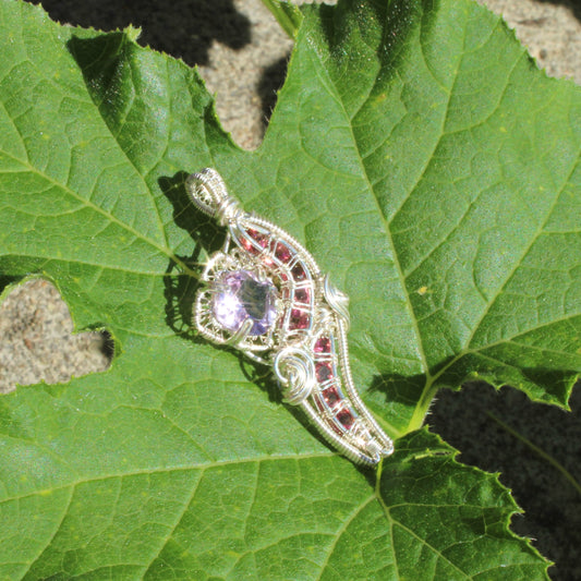 Amethyst Sterling Silver Pink Tourmaline Ring with Intricate Wire Design on a Natural Leaf Background