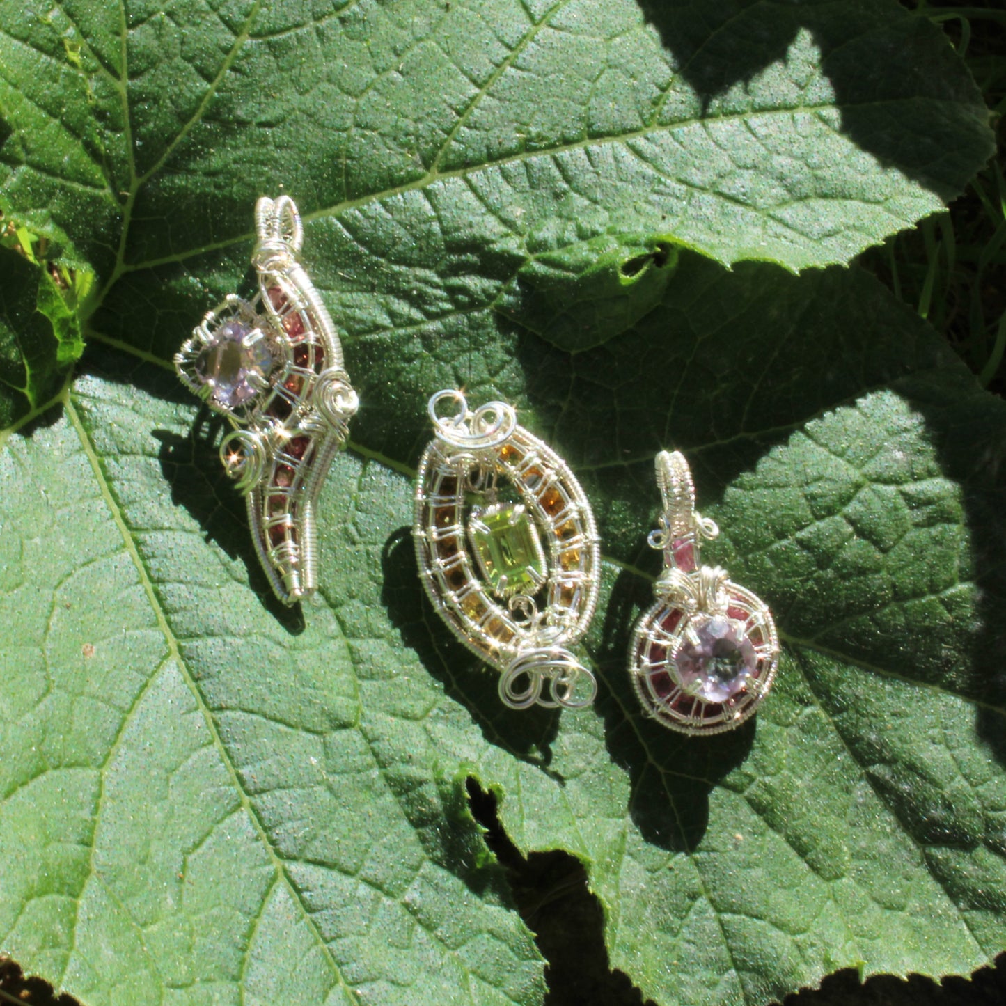 Handcrafted Jewelry Set featuring Amethyst Sterling Silver Pink Tourmaline Pendants on Green Leaves