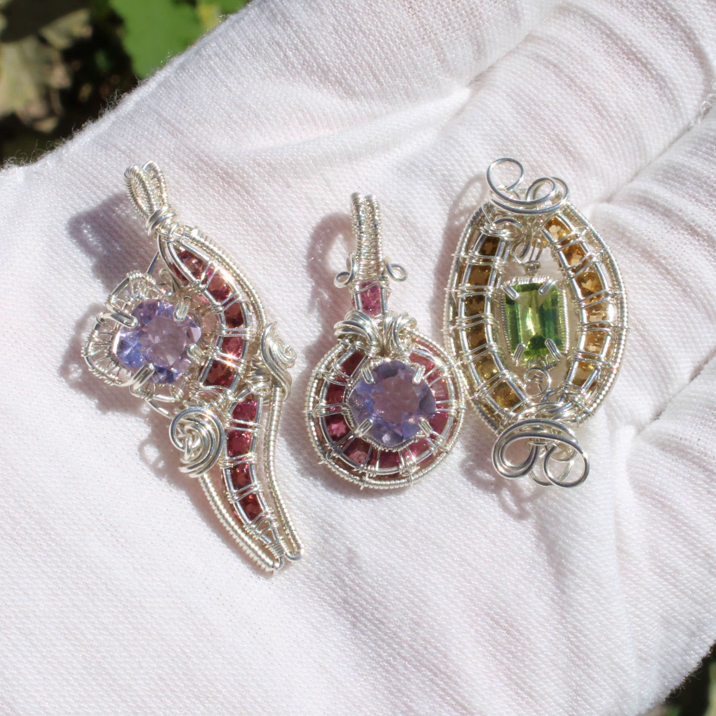 Handcrafted Amethyst Sterling Silver Pink Tourmaline pendants showcasing unique wire design and vibrant gemstones
