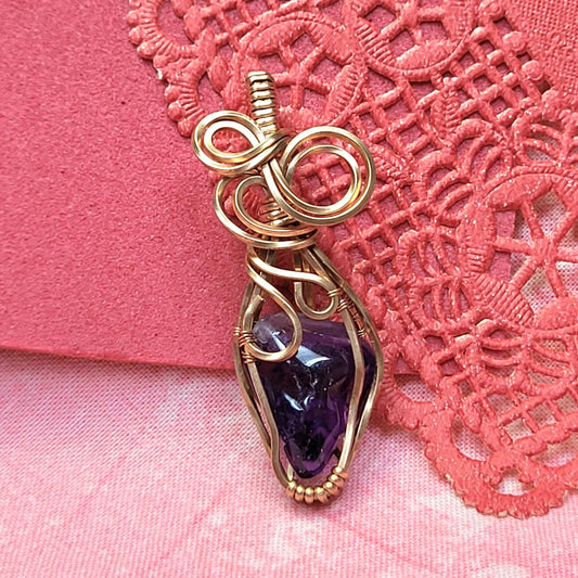 Handcrafted Amethyst Wire Wrapped Pendant with Unique Twisted Design