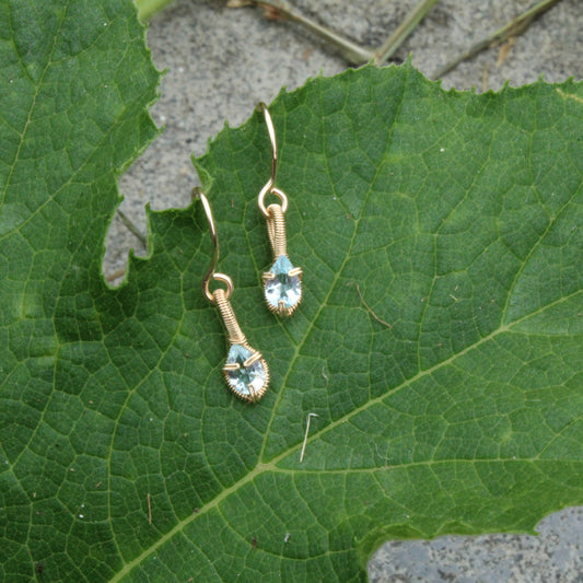 Aquamarine gold fill earrings featuring a delicate design and sparkling stones on gold hooks