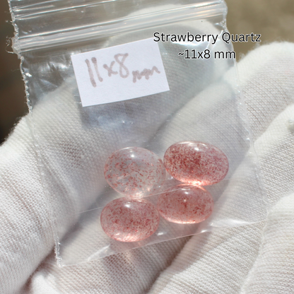 Strawberry quartz cabochons 11x8 mm in bag on gloved hand for Made to order rings