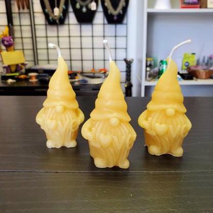 Set of three beeswax gnome candles with cheerful expressions and detailed designs