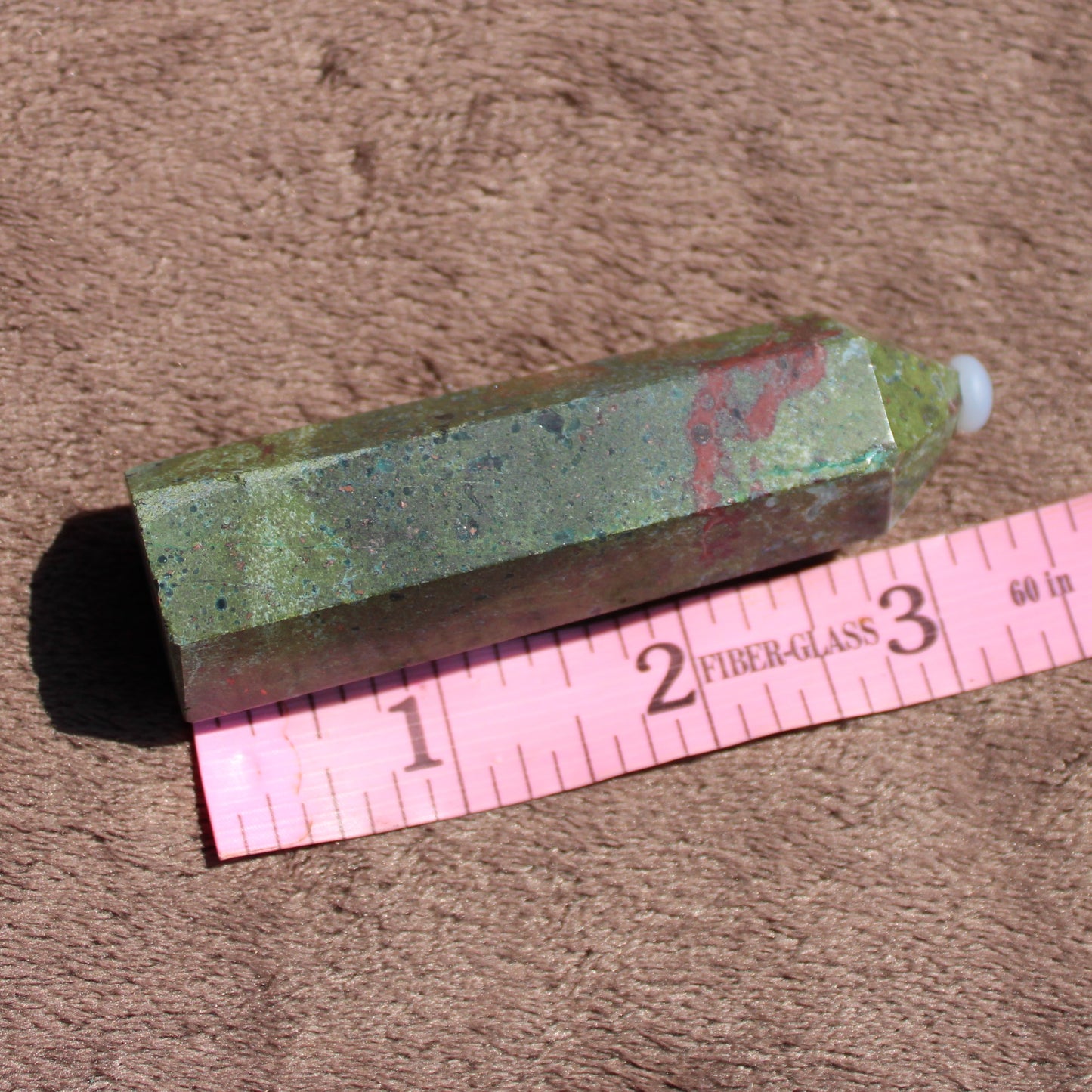 Bloodstone tower crystal with natural green and red hues, perfect for meditation and energy healing