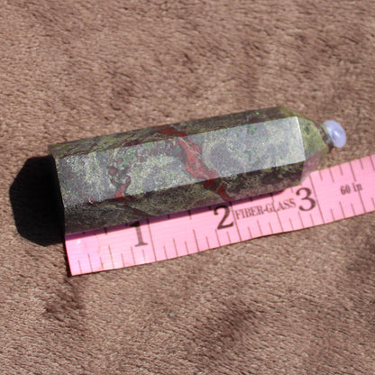 Bloodstone tower crystal with unique green patterns and red inclusions, measuring approximately 4 inches long