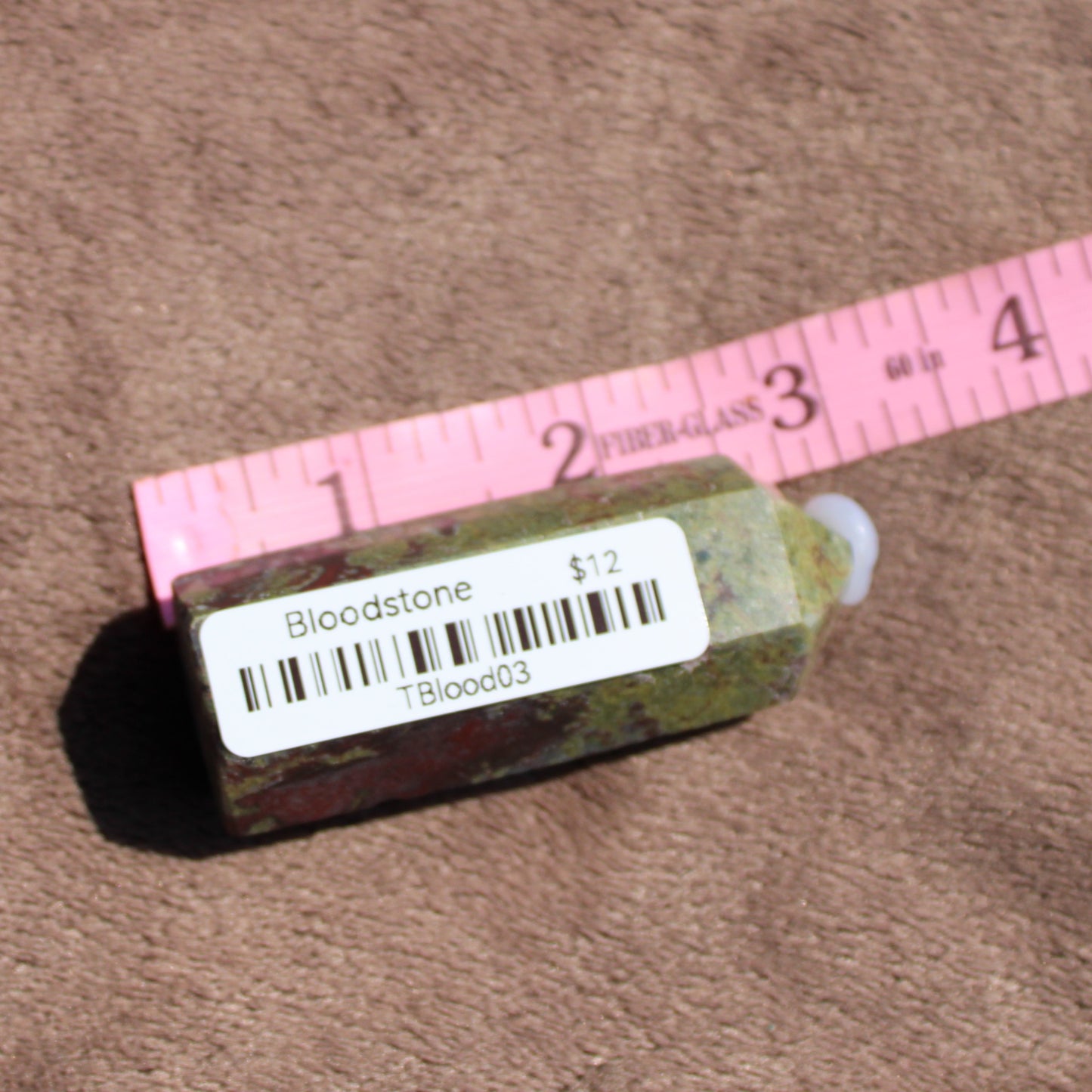 Unique Bloodstone tower with natural color variations, ideal for crystal healing and decoration
