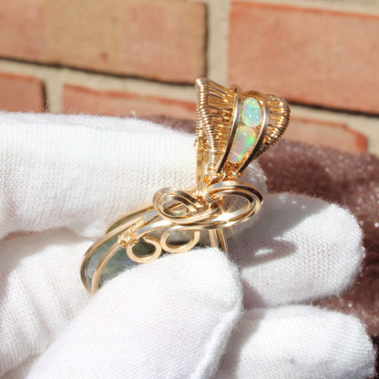 Unique Blue flash labradorite heart pendant elegantly wrapped in gold wire for stunning gemstone jewelry