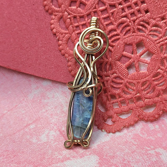 Handcrafted gold wire pendant featuring a polished Blue Kyanite gemstone for elegant jewelry lovers