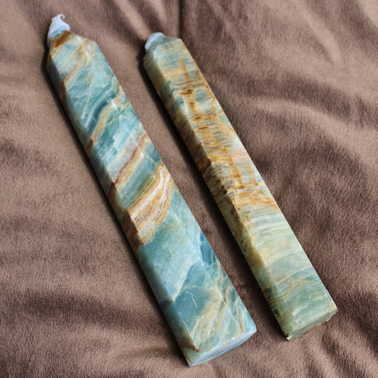 Two blue onyx towers featuring unique natural patterns in shades of blue and gold for home decor