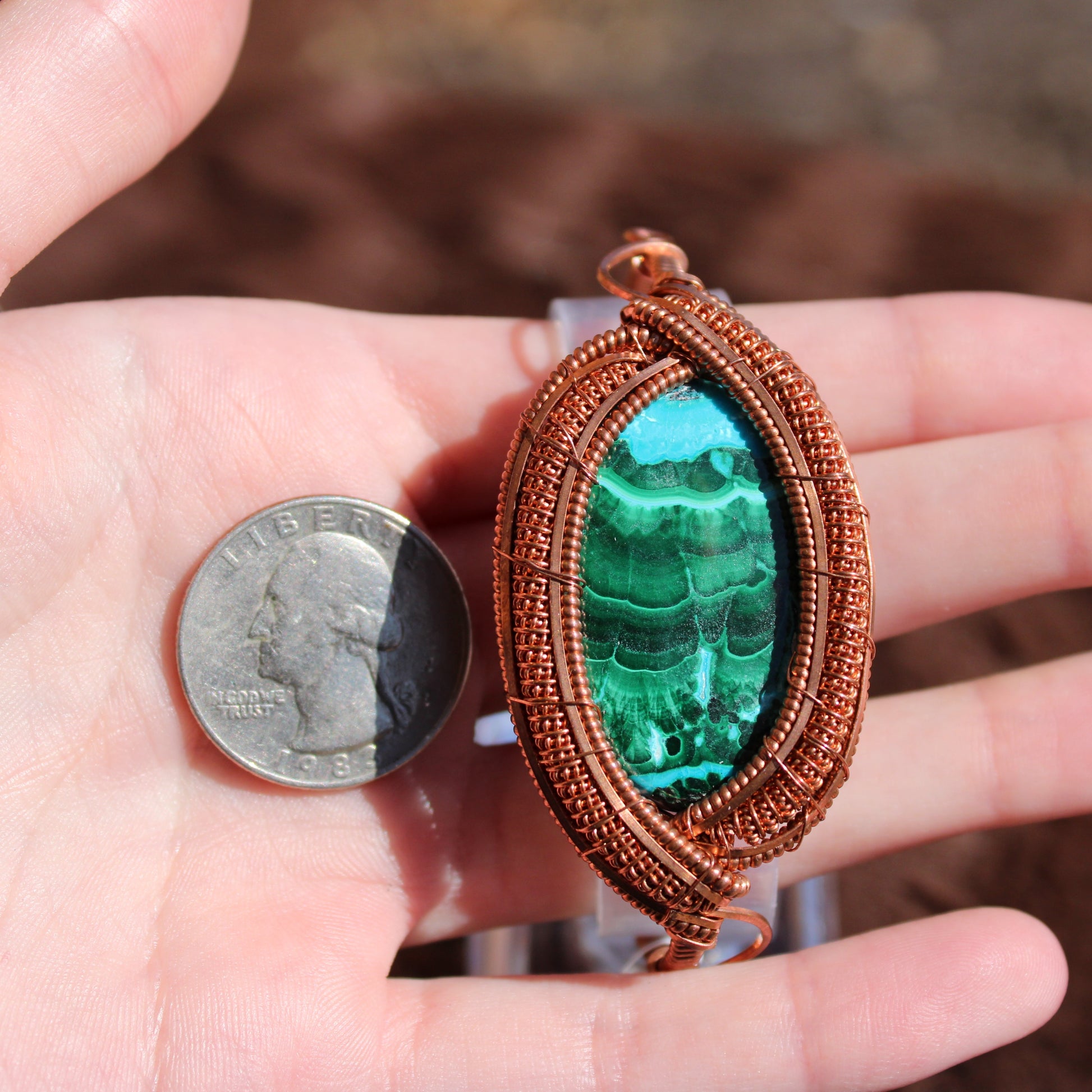 Chrysocolla Malachite Bracelet wrapped in copper, showcased beside a quarter for size comparison