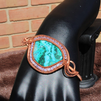 Chrysocolla malachite cz bracelet featuring a stunning green stone set in copper wire on display