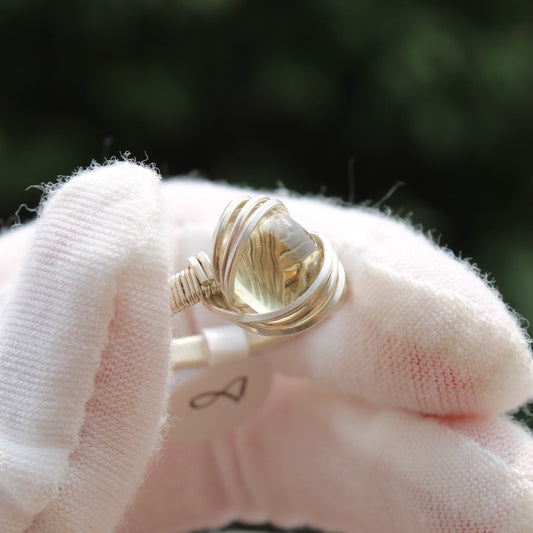 Handcrafted Citrine ring in a delicate gold setting, showcasing a bright yellow gem