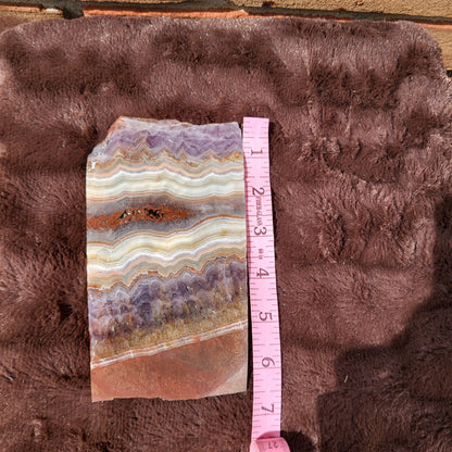 Crazy lace amethyst slab with unique patterns and colors for home decor and collection