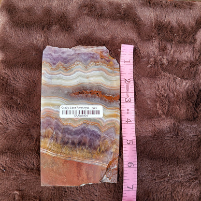 Beautiful Crazy Lace Amethyst slab showcasing unique banded patterns with rich colors