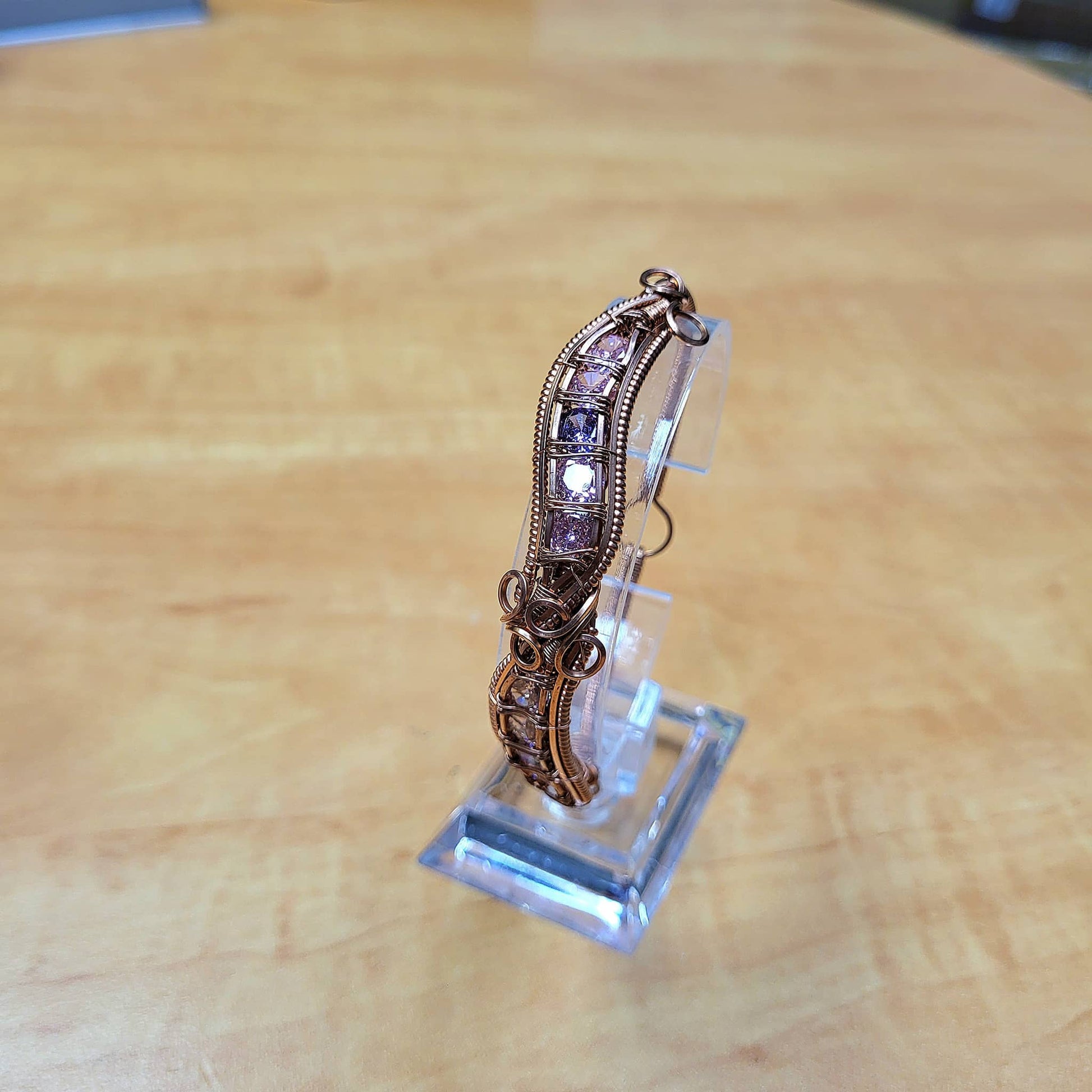 Elegant vintage cubic zirconia bracelet showcased on a display stand at Different Branches Crystal Gift Shop