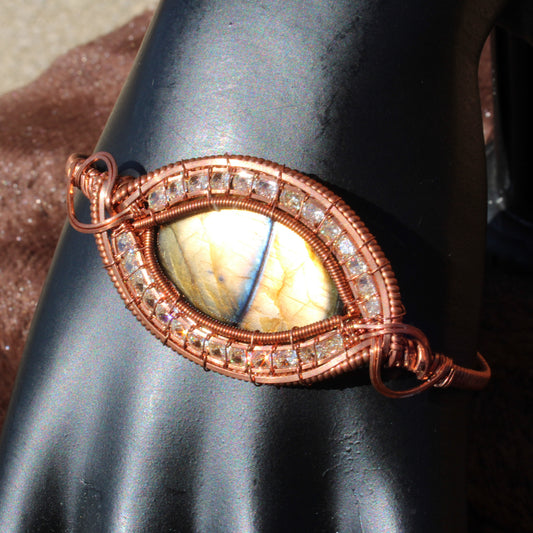 Dragon Eye Labradorite Bracelet with intricate wire wrapping and sparkling crystals showcasing a stunning gemstone