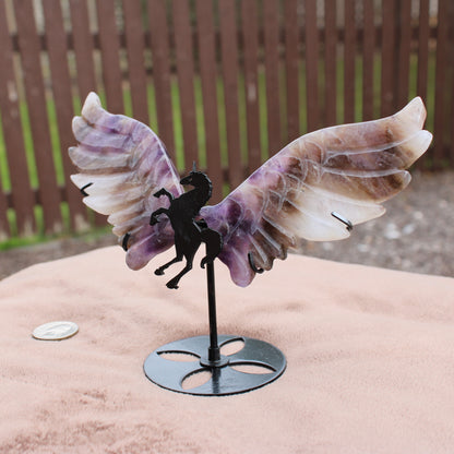 Dream Amethyst Unicorn Wings crystal sculpture with purple and white wings on black metal stand
