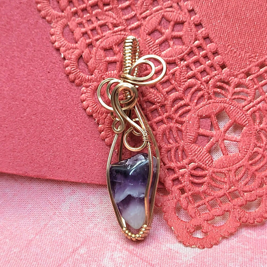 Handcrafted gold wire pendant featuring a unique dream amethyst crystal design