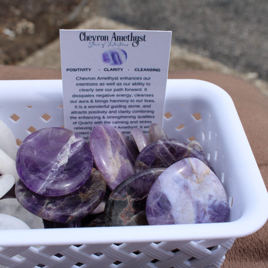 Dream Amethyst Worry Stone polished smooth purple crystals in white basket with info card