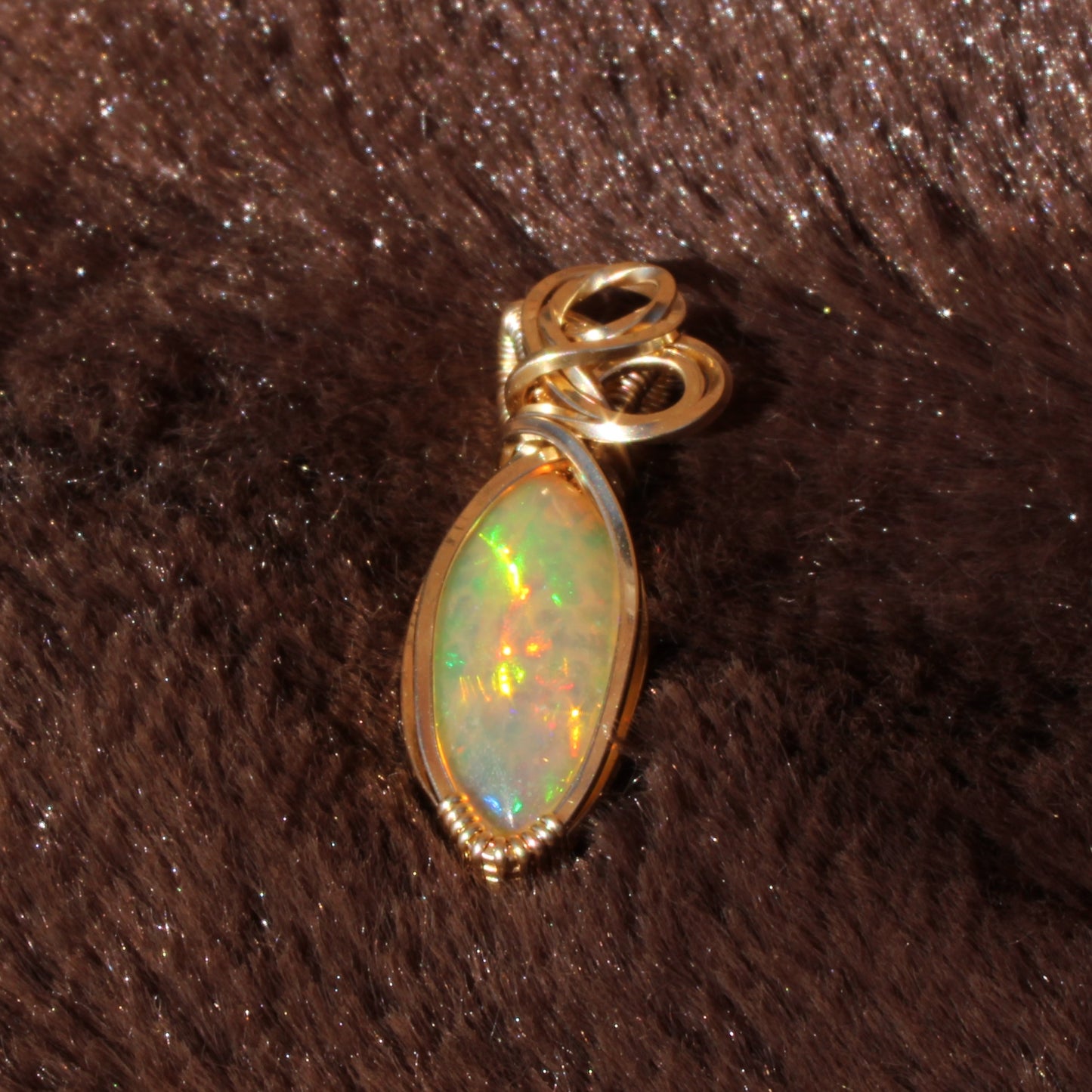 Ethiopian Opal 14k gold-filled pendant featuring a vibrant and colorful opal stone